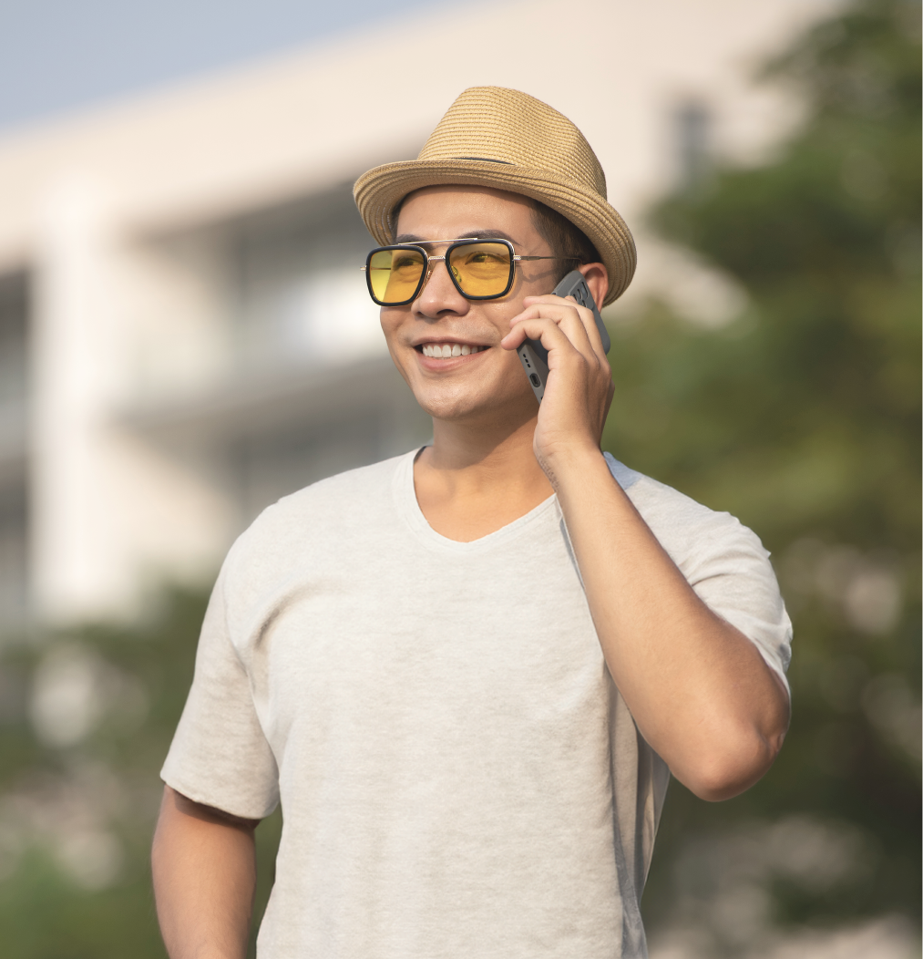 male-with-hat-talking-on-the-phone