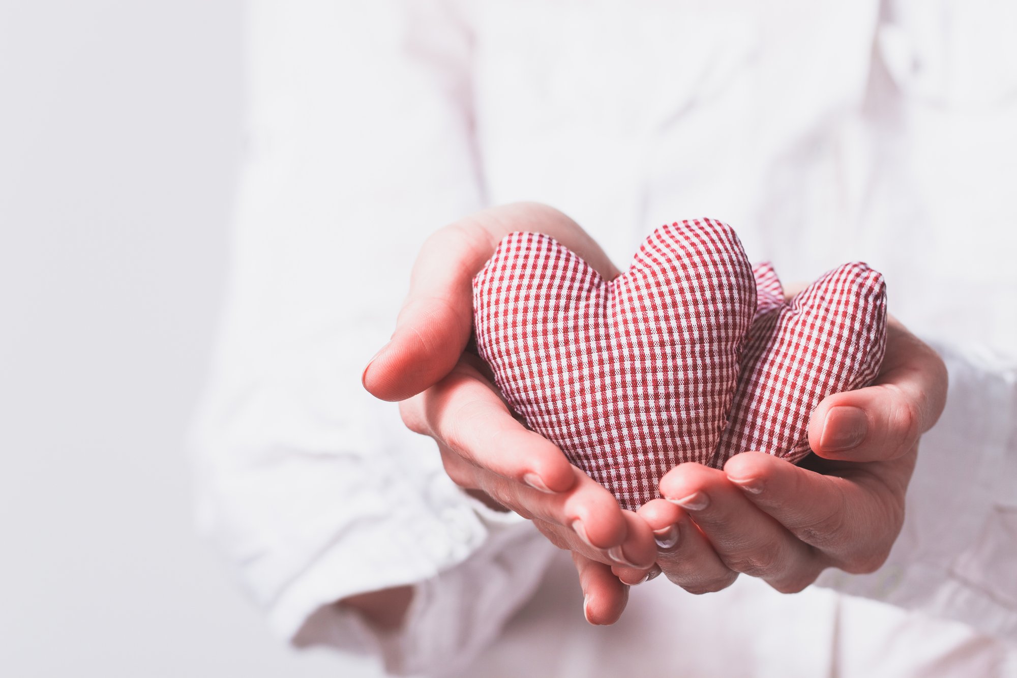 hands-holding-two-teddy-hearts